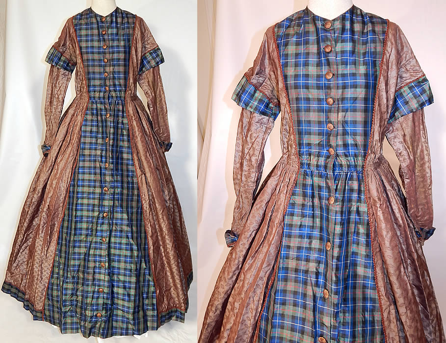 Victorian Civil War Era Silk Brocade Plaid Hoop Skirt Wrapper Gown Dress
This antique Victorian Civil War era silk brocade plaid hoop skirt wrapper gown dress dates from the 1860s. It is made of an iridescent brownish gray taupe color silk damask weave brocade with a holly leaf print design woven into the fabric and a blue, green, black, red plaid pattern silk taffeta fabric accent. 