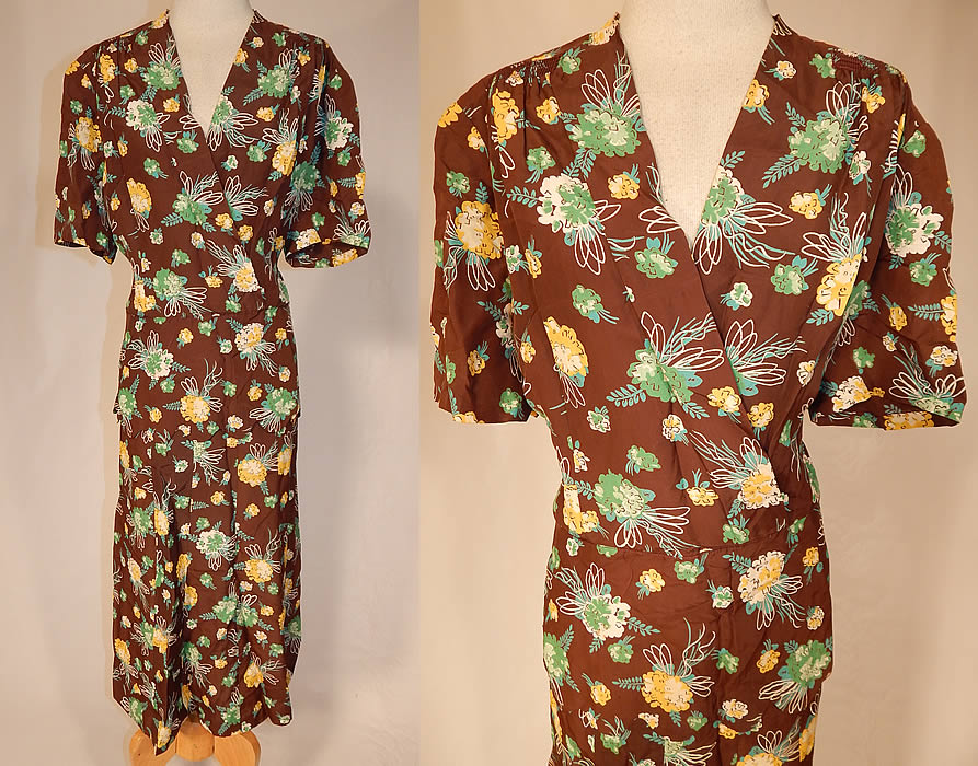 Vintage Brown Green Yellow Flower Bouquet Novelty Print Rayon Peplum Dress
This vintage brown, green, yellow flower bouquet novelty print rayon peplum dress dates from the 1940s. It is made of a brown rayon fabric with a green, yellow and white bouquet flower print design. This pretty novelty print dress has a fitted peplum skirted waist with scalloped hem, an open wrap front V neckline, slight shoulder padding, short sleeves, no opening closures and is unlined