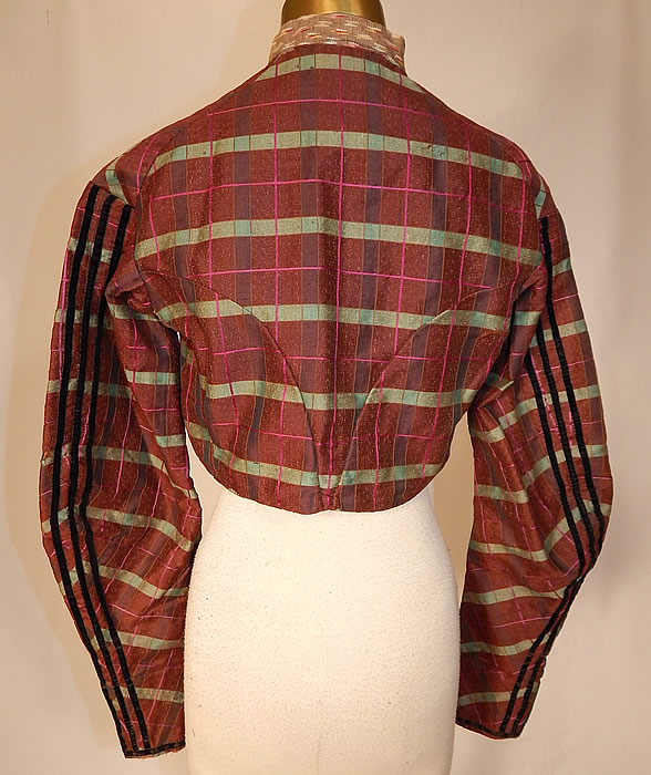 Victorian Civil War Brown Green Pink Plaid Stripe Wool Bodice Blouse Jacket Top
The bodice measures 14 inches long, with a 28 inch waist, 32 inch bust and 23 inch long sleeve. It is in good condition, with only a few tiny frayed pulls in the wool fabric. This is truly a wonderful piece of antique Victoriana textile art!