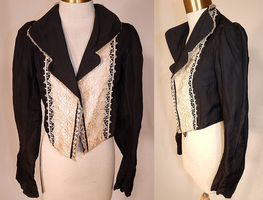 Victorian Black Silk White Lace Bolero Spencer Jacket Cropped Top
This antique Victorian era black silk white lace bolero spencer jacket cropped top dates from 1900. It is made of a black silk fabric, with white lace trim backed in white satin on the front.