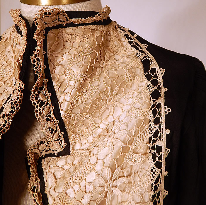 Victorian Black Silk White Lace Bolero Spencer Jacket Cropped Top
This beautiful bolero jacket short cropped spencer style top, has an open front with no closure, a wide lapel fold over collar, gathered shoulders with long tapered sleeves and is fully lined with stays boning sewn inside. 