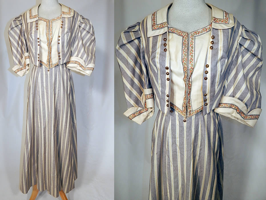 Edwardian Gray & White Striped Paisley Trim Summer Walking Suit Jacket Skirt
This antique Edwardian era gray and white striped paisley trim summer walking suit jacket and skirt dates from 1905. It is made of a gray and off white cream color striped fine wool fabric, with silk paisley ribbon trim edging and gold button accents on the top.