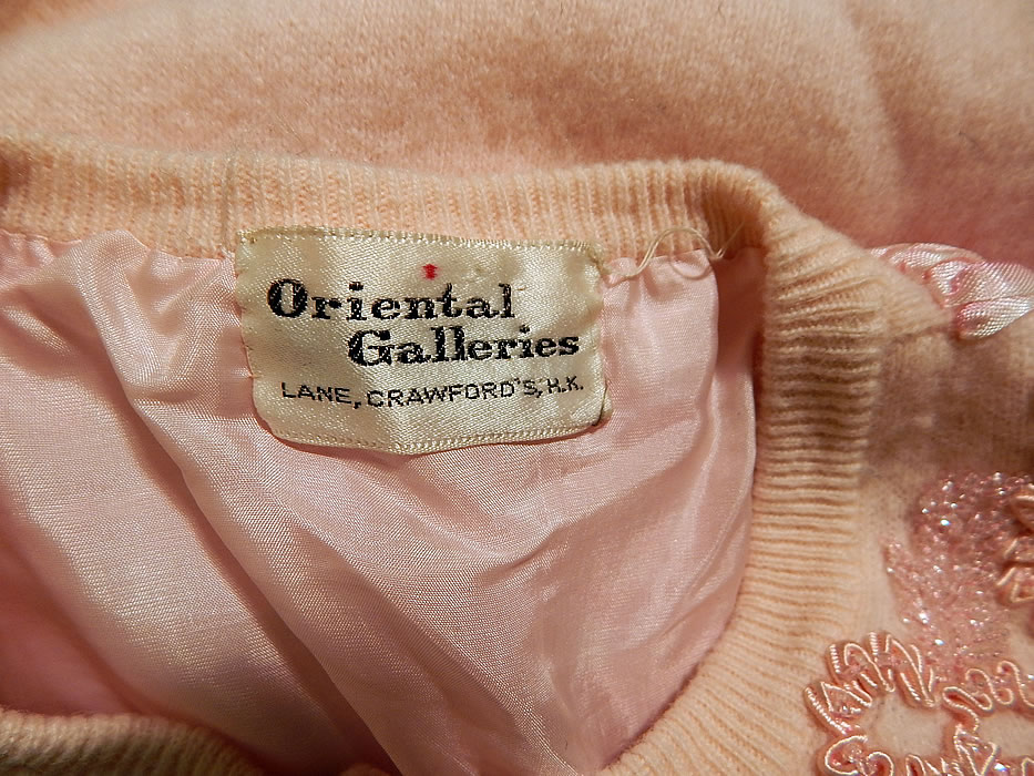 Vintage Oriental Galleries Hong Kong Pink Ribbon Work Beaded Sweater
There is a "Oriental Galleries Lane, Crawford's, Hong Kong" label sewn inside. It is in good condition, with only some pilling balls in areas. This is truly a wonderful piece of wearable art!