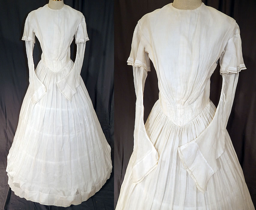 Victorian Era White Muslin Hoop Skirt Wedding Gown Dress
This antique Victorian era white muslin hoop skirt wedding gown dress dates from the 1840s. It is made of a light weight woven fine sheer white muslin fabric.