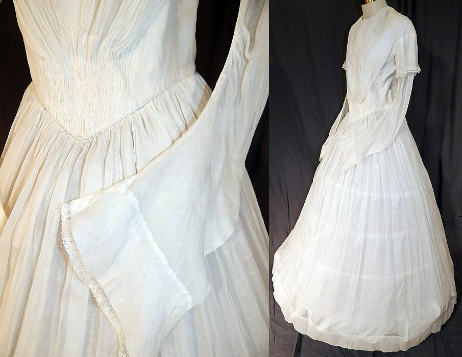 Victorian Era White Muslin Hoop Skirt Wedding Gown Dress
This early bridal wedding gown dress has long layered tiered tapered sleeves with a flared laced cuff under sleeve, a triangle shape bodice top with gathered cartridge pleats V point fitted waist, long full hoop skirt (hoop not included underneath), brass hook closures down the back and only the top is lined. 