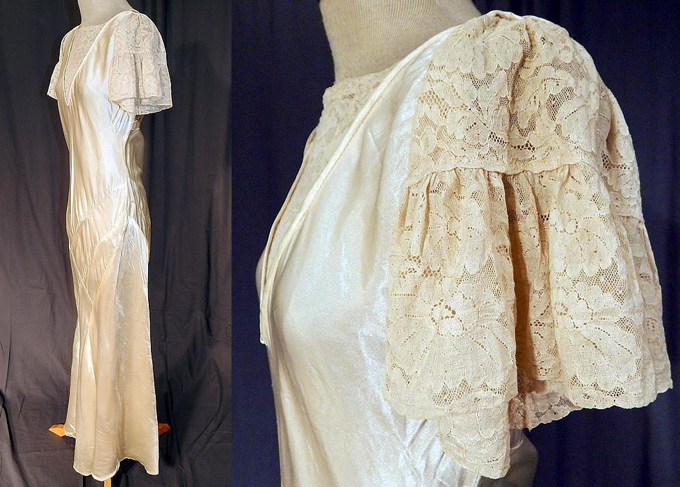 Vintage White Silk Satin & Lace Asymmetrical Bias Cut Wedding Gown Dress
The dress measures 55 inches long, with 36 inch hips, a 30 inch waist and 34 inch bust. 
