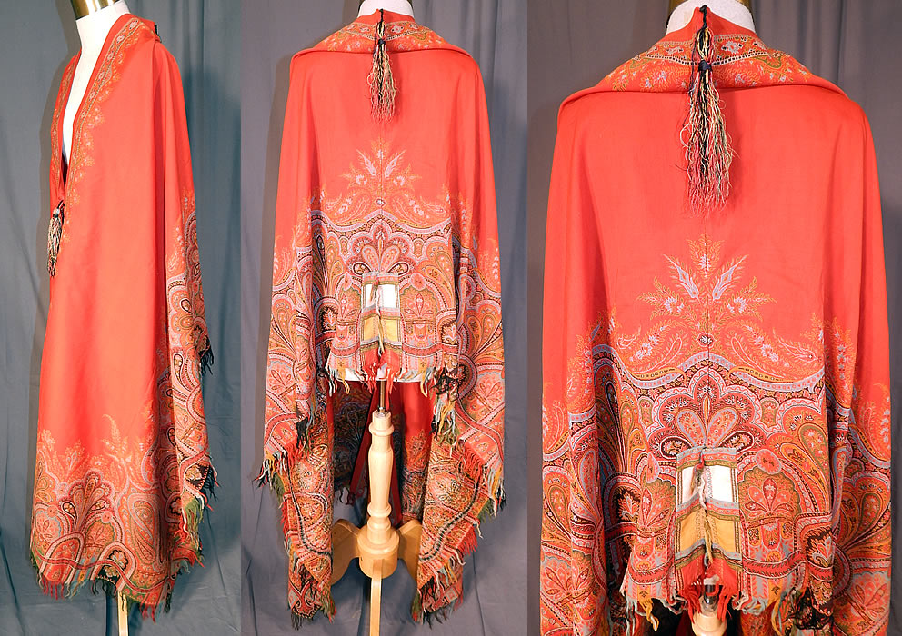 Victorian Antique Jacquard Red Wool Paisley Shawl Cloak Cape Tassel Trim
This stunning shawl was created into a long floor length cloak cape mantle with wonderful workmanship and detail, a colorful decorative fringed border along the bottom, tassel trim accents hanging down from the back neck drape and front closure. 