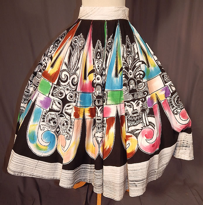Vintage Hand Painted Mexican Mayan Aztec Warrior Print Cotton Circle Skirt
This vintage hand painted Mexican Mayan Aztec warrior print cotton circle skirt dates from the 1950s. It is made of a cotton fabric, with a black and white, colorful hand painted air brushed silk screen design of Mexican Mayan Aztec warriors print. 