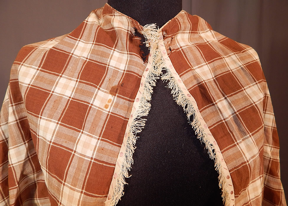 Victorian Brown & White Plaid Gingham Check Cotton Fichu Shawl Pelerine Cape
It is in fair as-is condition, with a frayed hole on the front neck and some small faint age spot stains (see close-up). This is truly a wonderful piece of early antique Victoriana wearable art! 