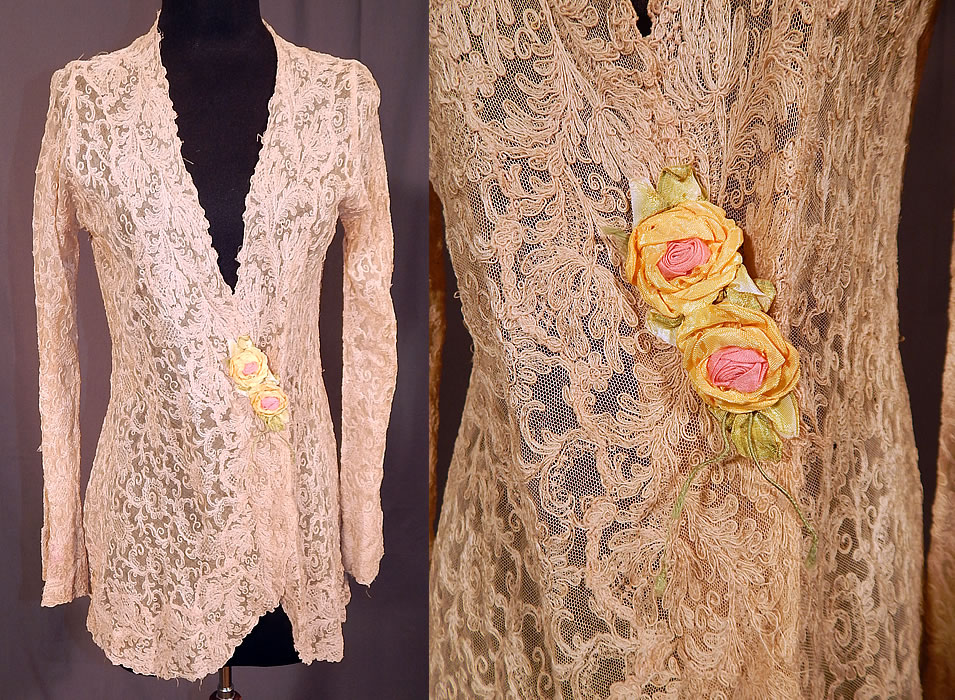 Vintage Silk Ribbon Rosette Trim Cream Tambour Embroidery Net Lace Jacket
This vintage silk ribbon rosette trim cream tambour embroidery net lace jacket dates from the 1920s. It is made of an off white ecru cream color sheer tambour embroidery net lace fabric, with a spiral, scrolling, floral design and yellow, pink silk ribbon rosette trim. 