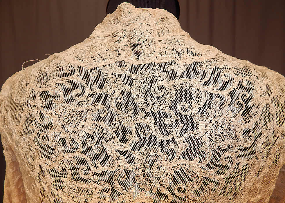 Vintage Silk Ribbon Rosette Trim Cream Tambour Embroidery Net Lace Jacket
The jacket measures 26 inches long, with a 28 inch waist, 34 inch bust and 23 inch sleeve. It is in good condition, with two tiny pin holes and a small fray on the neck. This is truly a wonderful piece of wearable rosette ribbon work lace art!