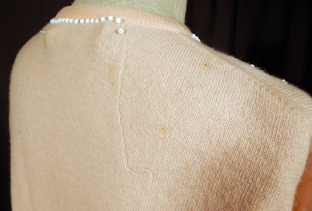 Vintage Pringle of Scotland Pink Cashmere White Beaded Cardigan Sweater
It is in good condition, but has not been cleaned with a few faint small stains and some loose missing beading on the neckline (see close-up). This is truly a wonderful piece of hand beaded wearable art!