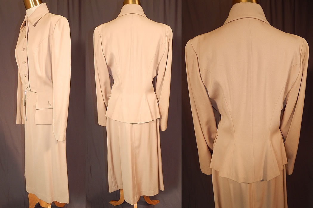 Vintage Susan Garber Originals Beige Gabardine Suit Jacket Pencil Skirt
This stunning tailored womens suit jacket has a cutaway bottom front, with button flap pockets, a skirted back, fold over collar, long full sleeves, fabric covered square dice shaped stitched buttons down the front for closure and is fully lined. 