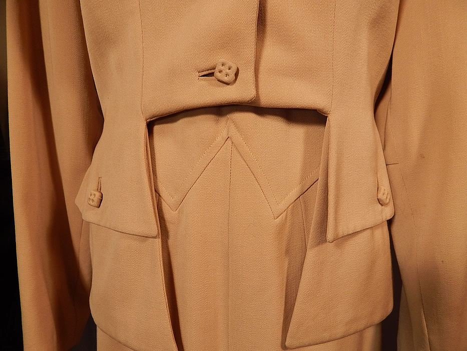 Vintage Susan Garber Originals Beige Gabardine Suit Jacket Pencil Skirt
The jacket measures 17 inches long in the front, 23 inches long in the back, with a 28 inch waist, 36 inch bust and 24 inch long sleeves. There is a matching fabric pencil skirt, with fitted decorative V stitched waist, side zipper closure, unlined and falls slightly below the knee. The skirt measures 32 inches long, with 40 inch hips and a 25 inch waist. The two piece suit is in good condition, with only a few tiny pin head size age spot stains on the sleeve and collar. This is truly a unique design and quality made piece of wearable art! 