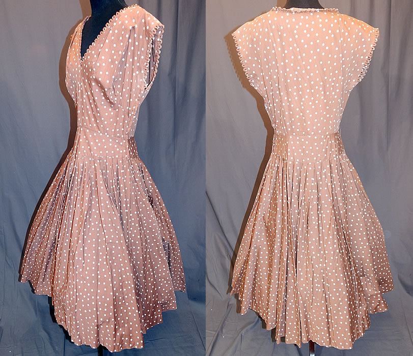 Vintage R & K Original Brown White Polka Dot Print Cotton Circle Skirt Dress
This "I Love Lucy" inspired dress has a fit and flare style, with a full circle skirt, scalloped loop trim edging along the V neckline and sleeveless arm holes, a side zipper closure and is unlined. 