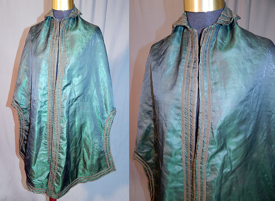 Victorian Civil War Era Iridescent Green Silk Batwing Dolman Mantle Cloak Cape
This antique Victorian Civil War era iridescent green silk batwing dolman mantle cloak cape dates from the 1860s. It is made of an iridescent dark green silk fabric, with black trim edging.