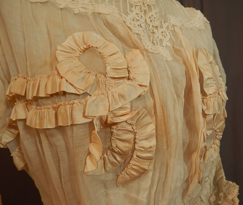 Edwardian White Cotton Muslin Lace Silk Ribbon Ruched Ruffle Trim Wedding Dress
It is in good condition, but has not been cleaned and has a few small faint stains on the front top, underarm and skirt. This is truly a wonderful piece of antique ribbon, lace textile art which could be worn as a wedding gown! 
