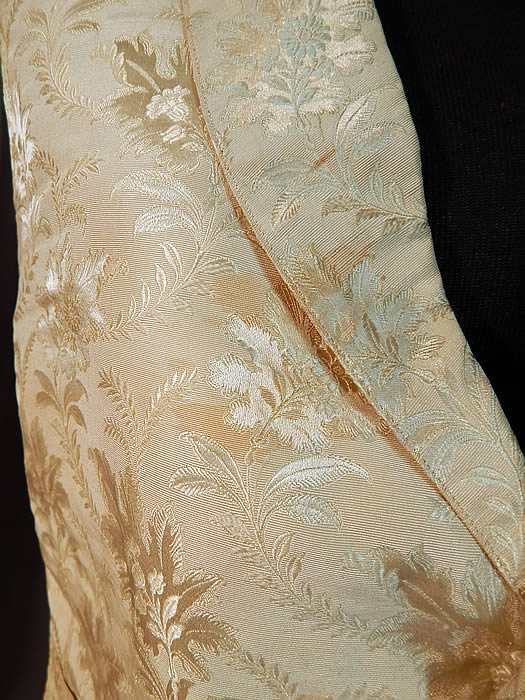 Victorian Gentleman's White Silk Damask Floral Brocade Wedding Waistcoat Vest
This dapper gentleman's wedding waistcoat vest has a V front opening, with a small fold over lapel collar, three front pockets and six silk fabric covered buttons for closure on the front. The vest measures 21 inches long, with a 28 inch waist and 38 inch chest. It is in good condition, with only two small open seams on the side which need minor repair stitching and a few faint small stains on the front (see close-up). This is truly a quality made men's early Victorian vest!