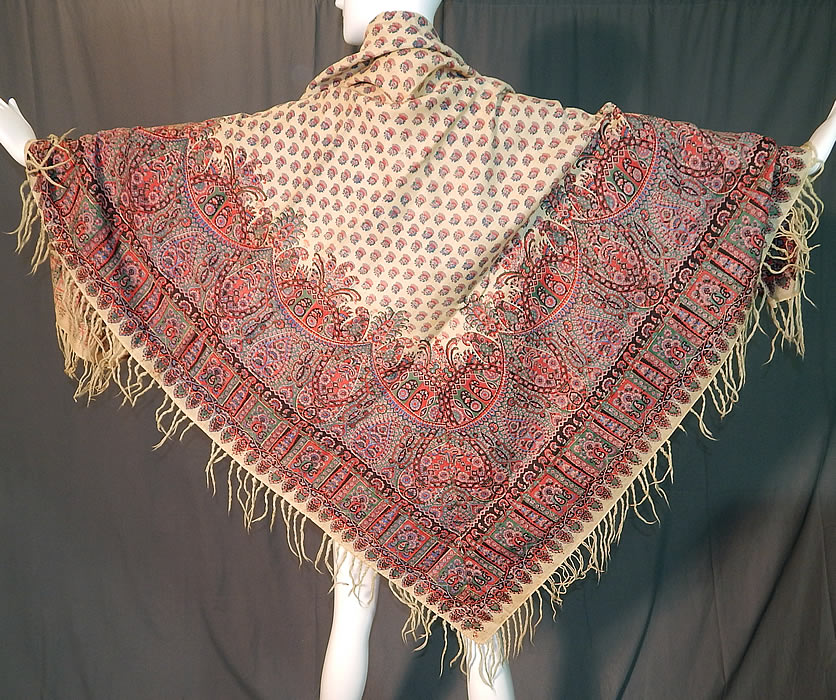 Victorian Antique Paisley Roller Print Wool Challis Fringed Shawl Scarf
This antique early Victorian era paisley roller print wool challis fringed shawl scarf dates from the 1850s. It is made of a soft light weight fine Kashmir challis wool weave drawloom fabric, with a cream color background, colorful pinks and blues natural dye roller print paisley pattern design done throughout.