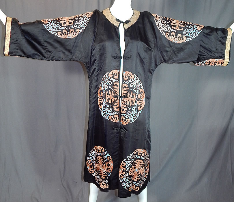 Antique Chinese Black Silk Embroidered Shou Longevity Medallion Gold Couching Coat Robe
This antique Chinese black silk embroidered shou longevity medallion gold couching coat robe dates from the 1920s