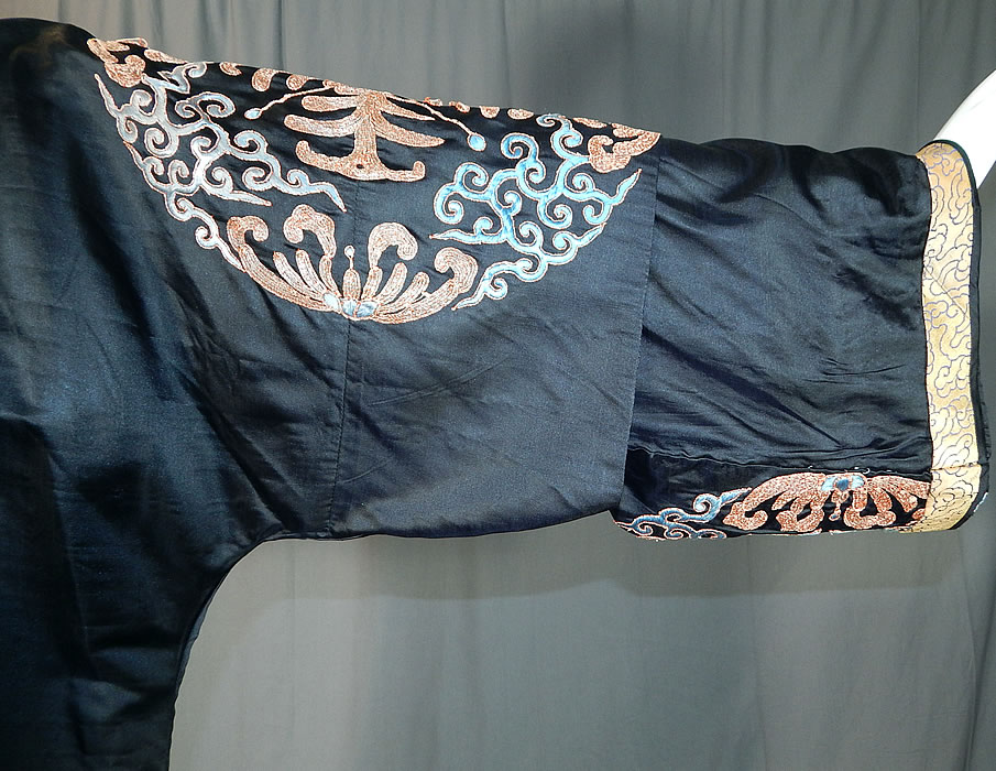 Antique Chinese Black Silk Embroidered Shou Longevity Medallion Gold Couching Coat Robe
It is made of a black silk fabric, with blue silk raised padded satin stitch and gold couching embroidery work decorative roundels medallions of the Chinese character shou that represents longevity symbolizing long life and good health.