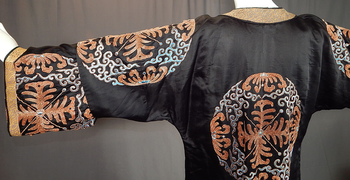Antique Chinese Black Silk Embroidered Shou Longevity Medallion Gold Couching Coat Robe
The robe measures 48 inches long, with a 42 inch waist and 44 inch chest. 