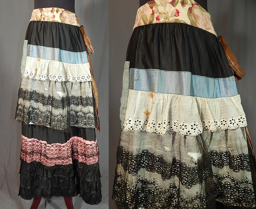 Victorian Black Cotton Ruffled Ribbon Lace Patchwork Petticoat Skirt Costume
This antique Victorian era black cotton ruffled ribbon, lace patchwork petticoat skirt costume dates from the 1880s. It is made of a black polished cotton fabric, with colorful patched remnants of fabric, ribbons, white eyelet, black laces creating a patchwork design.