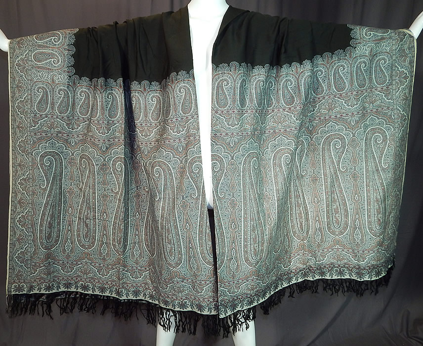 Victorian Antique Large Banquet Size Jacquard Loom Black & Blue Wool Paisley Shawl
This Victorian era antique large banquet size jacquard loom black and blue wool paisley shawl dates from the 1880s. It is made of jacquard hand loomed woven wool done in shades of blue, gold, black and white.