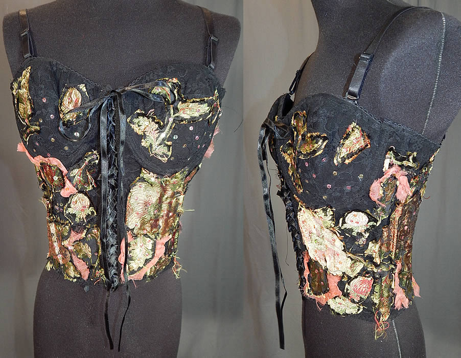 Vintage Alberto Makali Black Lace Silk Applique Trim Bustier Corset Top NWT
This vintage Alberto Makali black lace silk appliqu&eacute; trim bustier corset top NWT dates from 1990. It is made of a black nylon lace fabric, with pastel pink and green silk damask floral print appliqu&eacute; trim intentionally frayed and pieced together in a patchwork design and iridescent sequin accents.