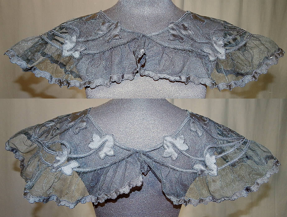 Vintage Black Silk Tulle Net Applique Shawl Collar Cape Capelet Dress Trim
This vintage black silk tulle net appliqu&eacute; shawl collar cape capelet dress trim dates from the 1930s. It is made of a black sheer tulle mesh net fabric with black silk appliqu&eacute; leaf shape cut outs and scalloped trim edging. 