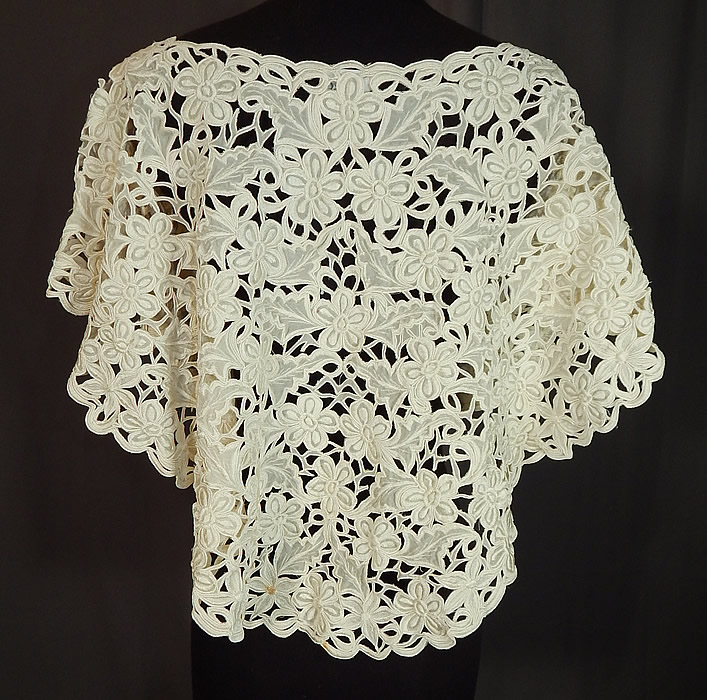 Vintage Rustan's Filipiniana Philippines White Silk Lace Cutwork Shawl Collar Cape
This sensational shawl style Bertha collar cape capelet has a scalloped edging, large wide round shape, with an open neck over the head style, no closures and is sheer, unlined. 