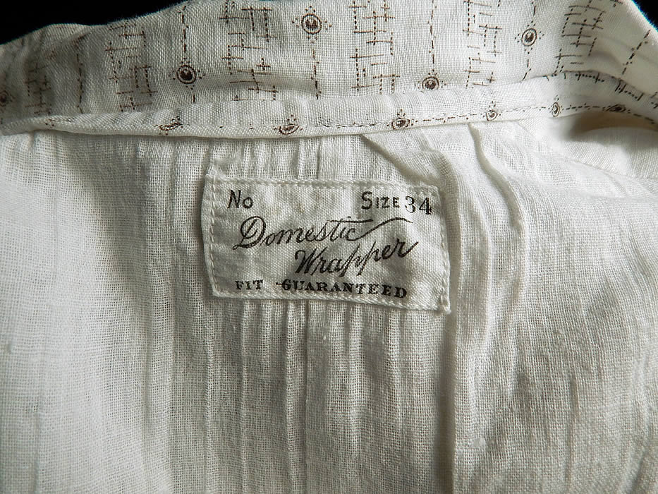 Domestic Wrapper Label Victorian Black & White Cotton Calico Print Workwear Dress
There is a "Domestic Wrapper Fit Guaranteed Size 34." label sewn inside.
