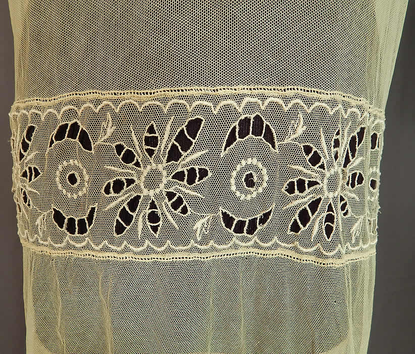 Vintage Cream Sheer Tulle Net Eyelet Cutwork Lace Floral Drop Waist Dress
This lovely lace dress is loose fitting, with a drop waist, short sleeves, full skirt, snap closures on the back and is sheer, unlined.