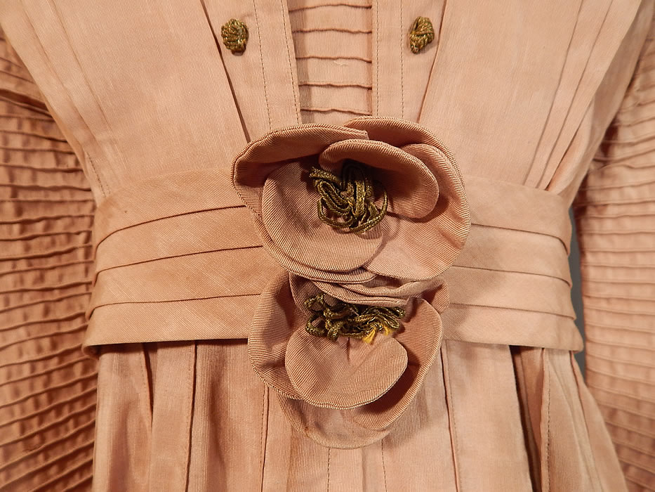 Edwardian Pleated Pink Cotton Silk Moire Gold Embroidered Lace Collar Dress Gown
It is in good condition, but has not been cleaned, with slight underarm discoloration, some staining along the bottom skirt hem and fraying on the top edging of the collar. This is truly a wonderful quality made piece of wearable art! 