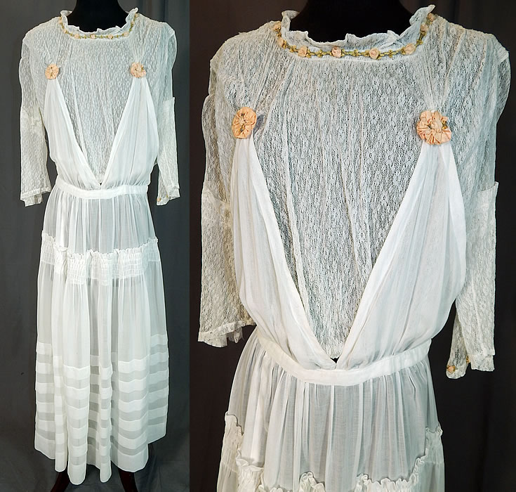 Edwardian White Cotton Lace Pink Silk Rosette Ribbon Trim Pinafore Dress
This vintage Edwardian era white cotton lace pink silk rosette ribbon trim pinafore dress dates from 1915. It is made of a white pleated cotton skirt, sheer lace top and pink pastel silk rosette ribbon work trim around the neckline, sleeve cuffs and top.