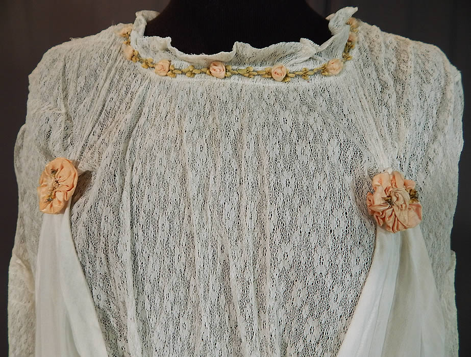 Edwardian White Cotton Lace Pink Silk Rosette Ribbon Trim Pinafore Dress
This lovely lace dress is a long tea length, with a pinafore style, attaching to the lace top with rosette covered snaps on both the front and back, , 3/4 length sleeves, a fitted waistband, snap closures down the back and is unlined with a sheer top.
