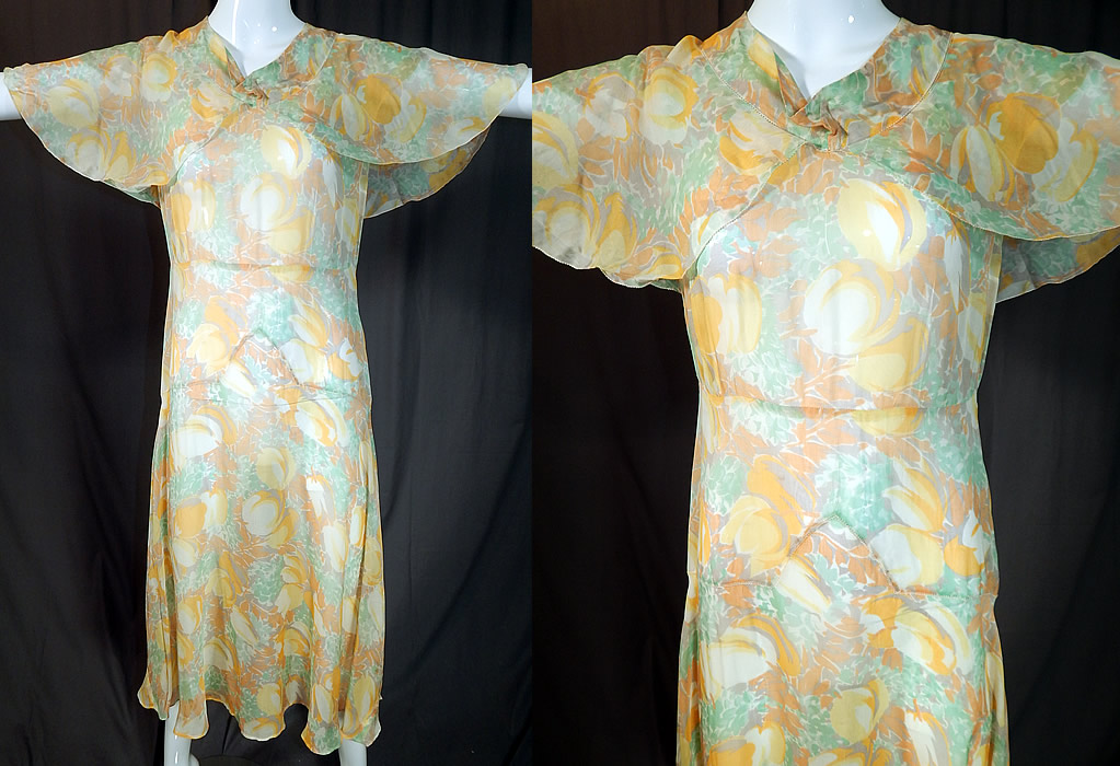Vintage Yellow Tulip Flower Print Silk Shawl Collar Cape Bias Cut Dress
This vintage yellow tulip flower print silk shawl collar cape bias cut dress dates from the 1930s. It is made of muted pastel shades of yellow, green and gold with an abstract tulip flower print on a sheer silk rayon blend fabric.