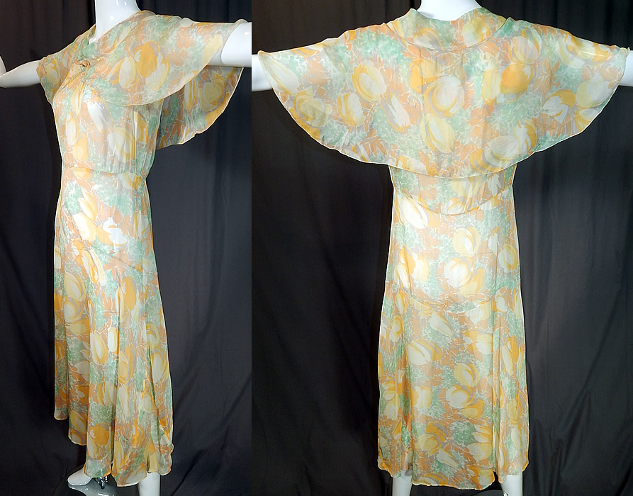 Vintage Yellow Tulip Flower Print Silk Shawl Collar Cape Bias Cut Dress
The dress measures 47 inches long, with 44 inch hips, a 30 inch waist and 36 inch bust. 