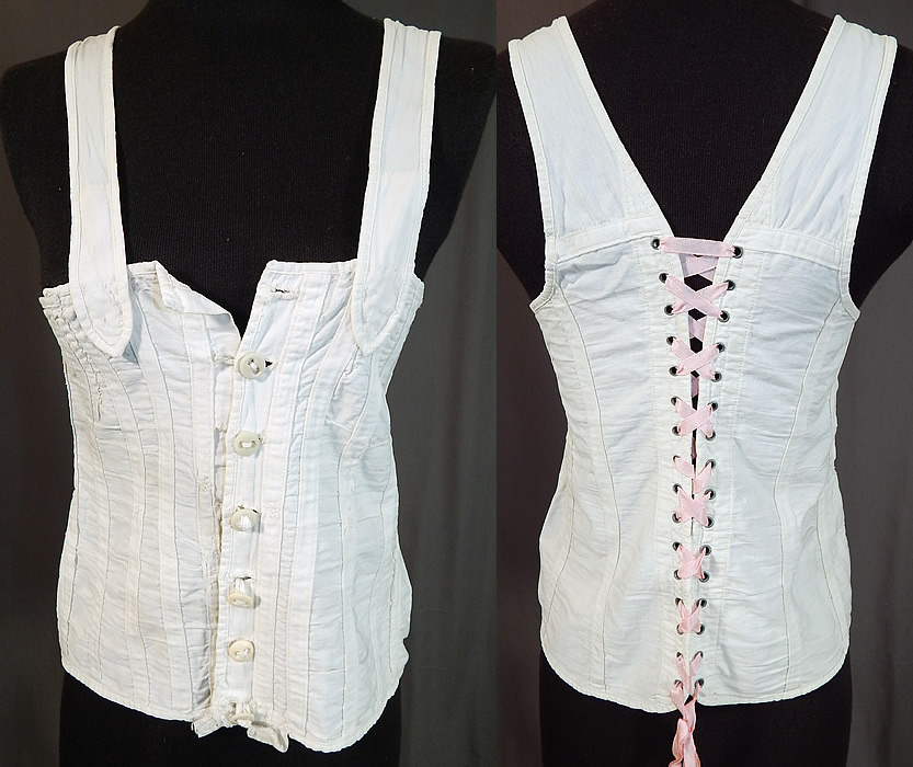 Victorian White Cotton Twill Stays Health Corset Camisole Top Underwear
This antique Victorian era white cotton twill stays health corset camisole top underwear dates from 1890. It is made of a white cotton twill fabric, with reinforced fabric stays. This "Perfect Health" style stays corset has a camisole top with shoulder straps, button front closures and adjustable corseted lacing back.