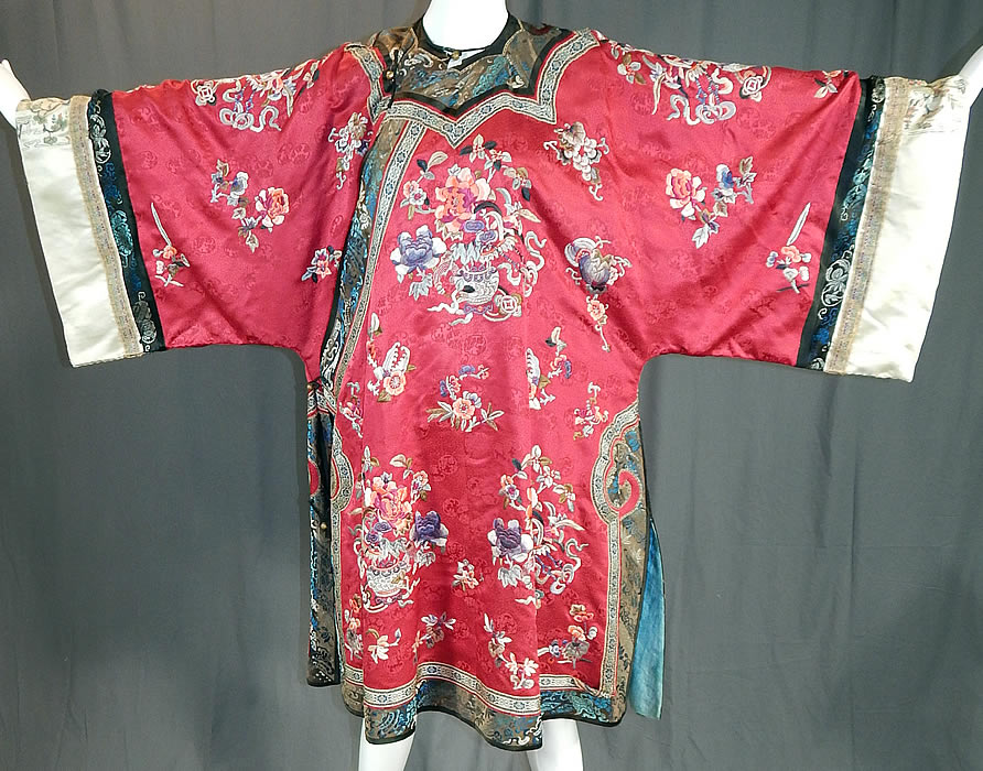 Antique Chinese Red Silk Embroidered Forbidden Stitch Sleeve Band Cuff Qipao Robe
This antique Chinese red silk embroidered forbidden stitch sleeve band cuff qipao robe dates from the late 19th century during the Qing Dynasty.