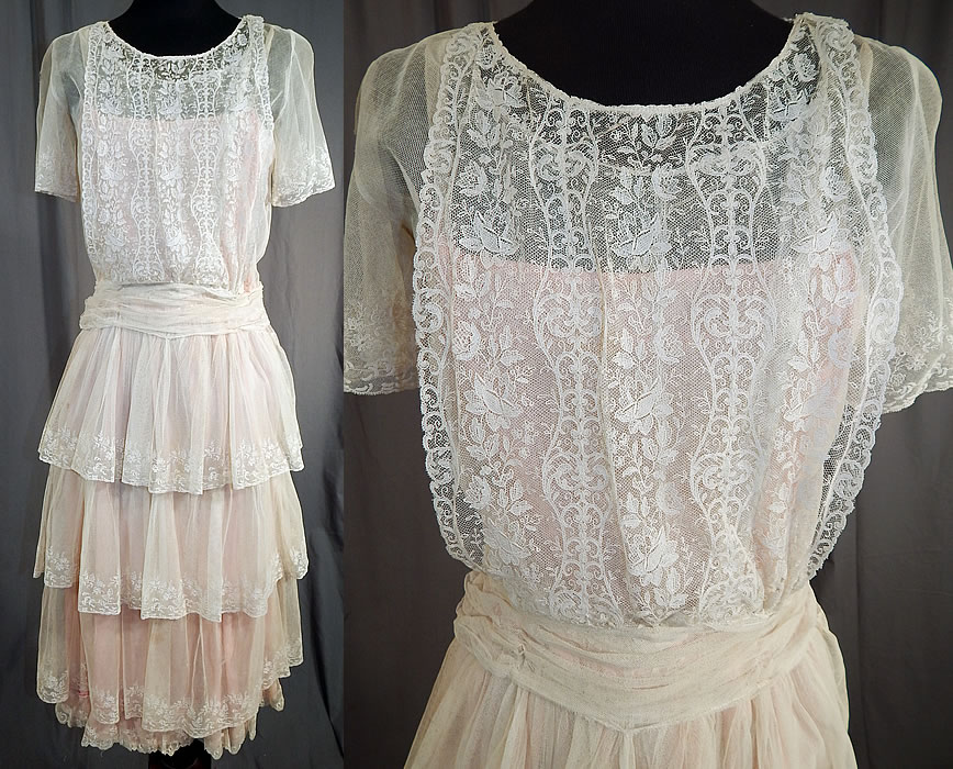 Vintage White Net Brussels Applique Duchesse Bobbin Lace Pink Silk Slip Dress
This vintage white net Brussels appliqu&eacute; Duchesse bobbin lace pink silk slip dress dates from the 1920s. It is made of a sheer white machine made net fabric, with Duchesse motifs rose flowers appliqu&eacute;d Brussels bobbin lace trim on the front bib top, sleeve cuffs and skirt ruffles.