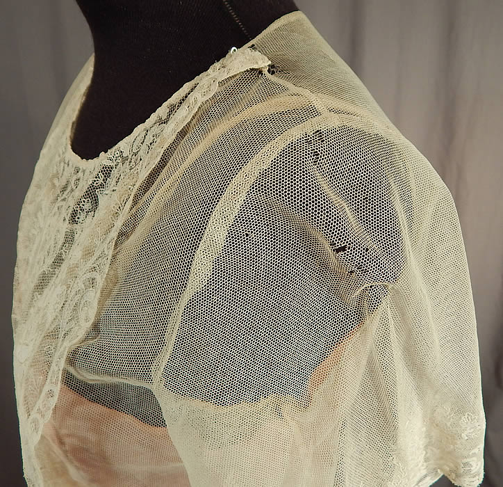 Vintage White Net Brussels Applique Duchesse Bobbin Lace Pink Silk Slip Dress
It is in good as-is condition, has not been cleaned with a few faint age spot stains on the skirt, some small frayed holes along the shoulders, sleeves and a small mended repair on the skirt ruffle (see close-ups).