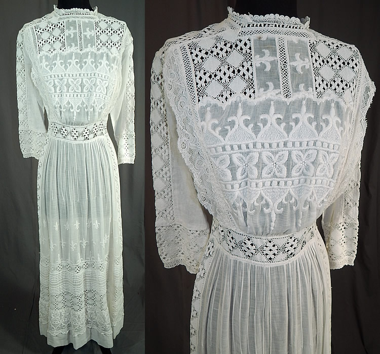Edwardian White Cotton Batiste Fleur-de-lis Embroidered Lace Lawn Dress Tea Gown
This vintage Edwardian era white cotton batiste fleur-de-lis embroidered lace lawn dress tea gown dates from 1910. It is made of a sheer white cotton batiste lawn fabric, with a white raised padded satin stitch embroidery work whitework done in fleur-de-lis, decorative designs, pleated stitching and cluny torchon bobbin lace trim inserts.