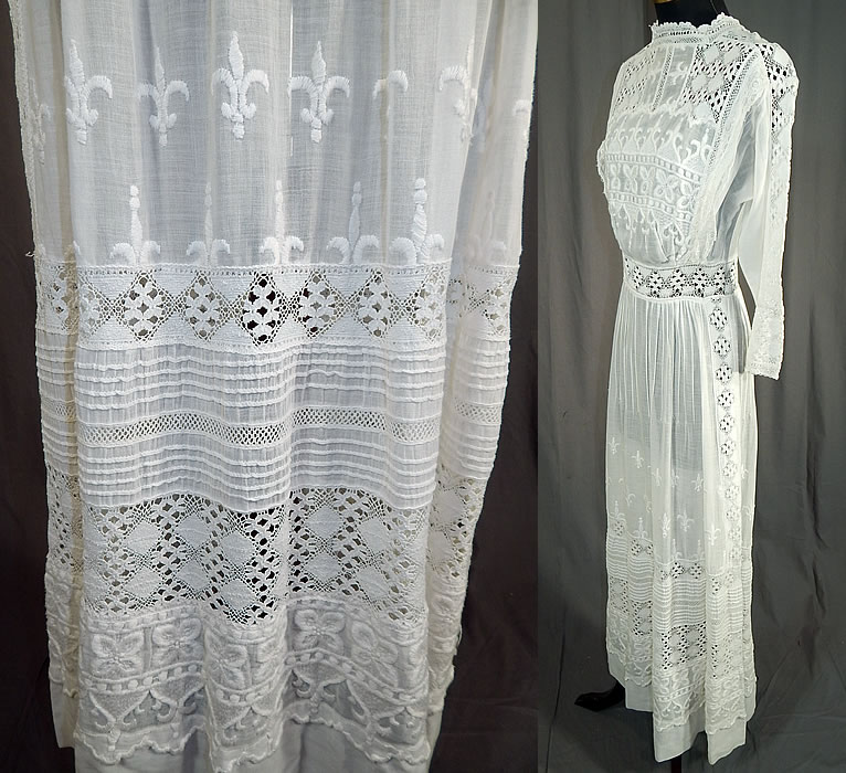 Edwardian White Cotton Batiste Fleur-de-lis Embroidered Lace Lawn Dress Tea Gown
This lovely lace lawn dress is a long tea length, with a lace trim high neckline, fitted waistband, long sleeves, button closures down the back and is sheer, unlined. 