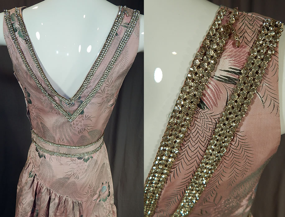 Vintage French Silk Damask Brocade Rhinestone Beaded Evening Gown Dress
This gorgeous elegant evening gown dress has a high low back skirt with layered tiered ruffle side drape, weighted hemline, plunging V necklines, sleeveless, a fitted waist, newer replaced plastic side snap closures and is unlined.