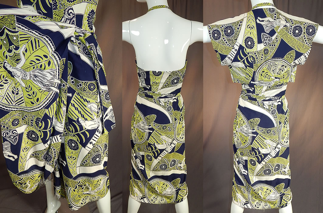 Vintage Poi Pounder Tog Hawaiian Hula Print Rayon Sarong Dress Shrug Jacket
The dress measures 38 inches long, with 34 inch hips, a 24 inch waist and 32 inch bust. There is a matching print fabric short cropped shrug bolero jacket with an open front and no closure. 