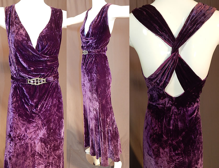 Vintage Art Deco Purple Panne Crushed Velvet Belted Bias Cut Evening Gown Dress
This gorgeous gown evening dress is a long floor length, with a sexy, sleeveless form fitting style, plunging V neckline wrap front, criss crossing twisted straps on the back, an attached belted front with movable linked rhinestone, amethyst glass beaded buckle trim, no side opening and is unlined. The dress measures 58 inches long, with 38 inch hips, a 30 inch waist and 36 inch bust.