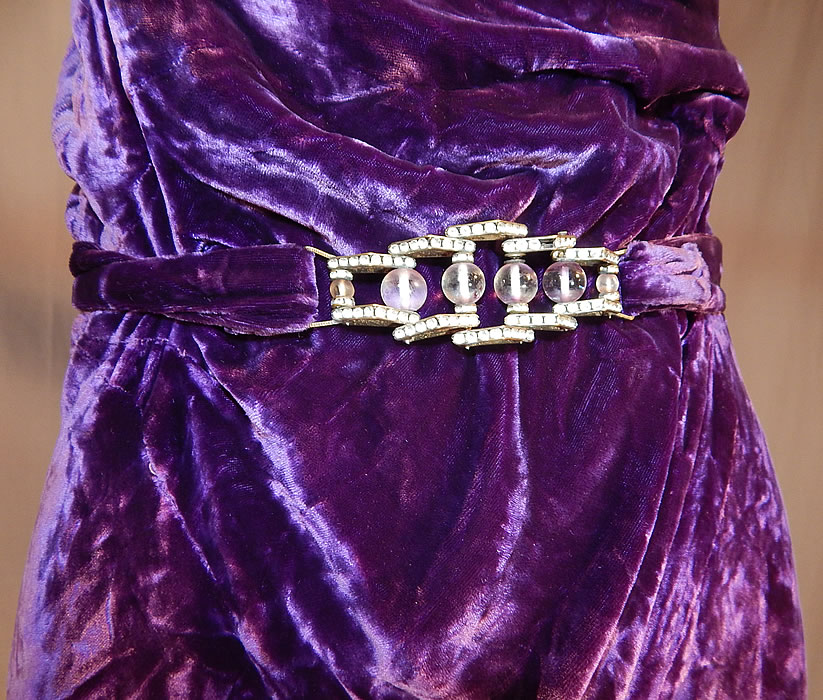 Vintage Art Deco Purple Panne Crushed Velvet Belted Bias Cut Evening Gown Dress
It is in good condition, has not been cleaned, with a slight musty odor, missing one rhinestone on the buckle and has some fraying on the silk chiffon backing the straps. This is truly a rare and luxurious piece of Art Deco wearable textile art!