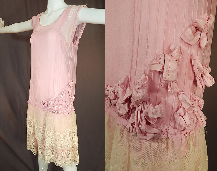 Vintage Pleated Pink Silk Rosette Flowers Cream Lace Ruffle Skirt Drop Waist Dress
This pretty pink lace loose fitting drop waist dress has a short tiered layered lace ruffle skirt, sleeveless with ruffle edged armholes and has an attached pink silk slip lining sewn inside. 