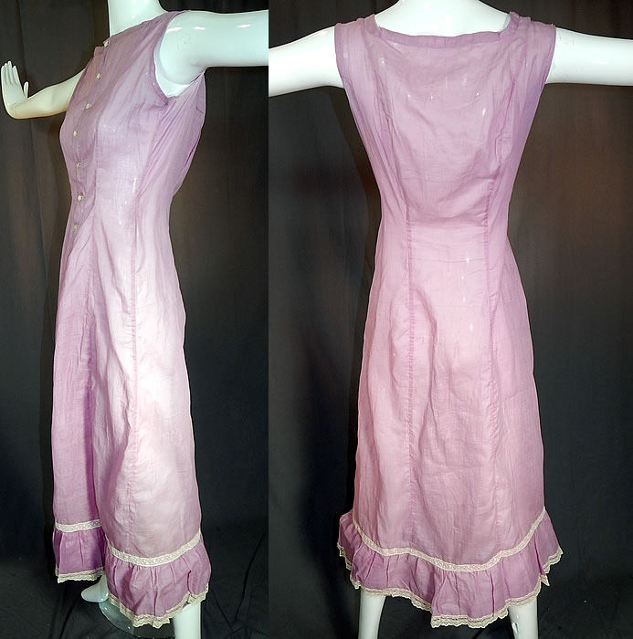 Edwardian Purple Lavender Cotton Batiste White Lace Trim Full Slip Dress
This lovely lavender and lace lingerie undergarment long full slip dress has is a long floor length, with full skirt, ruffle hemline, sleeveless, mother of pearl button front closure and is sheer, unlined. The slip measures 51 inches long, with 40 inch hips, a 22 inch waist and 36 inch bust. 